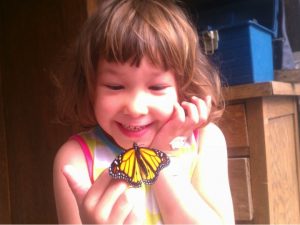 Nola Hamilton Garcia with Monarch butterfly