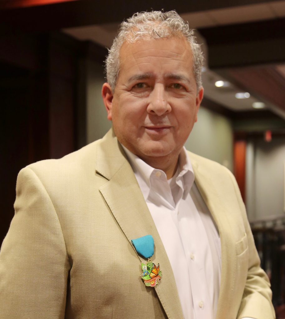 Robert R Puente with SAWS Fiesta Medal (1) Texas Butterfly Ranch